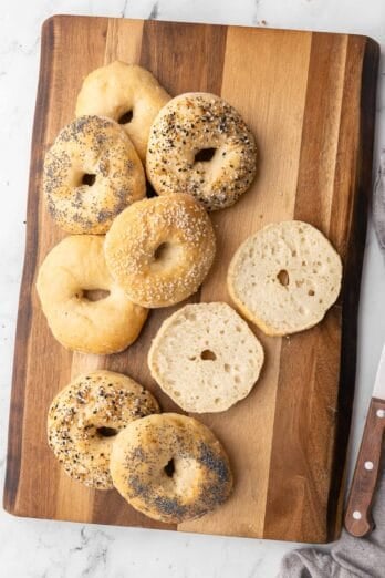 2 ingredient bagels on a cutting board with one split in half to show inside texture.