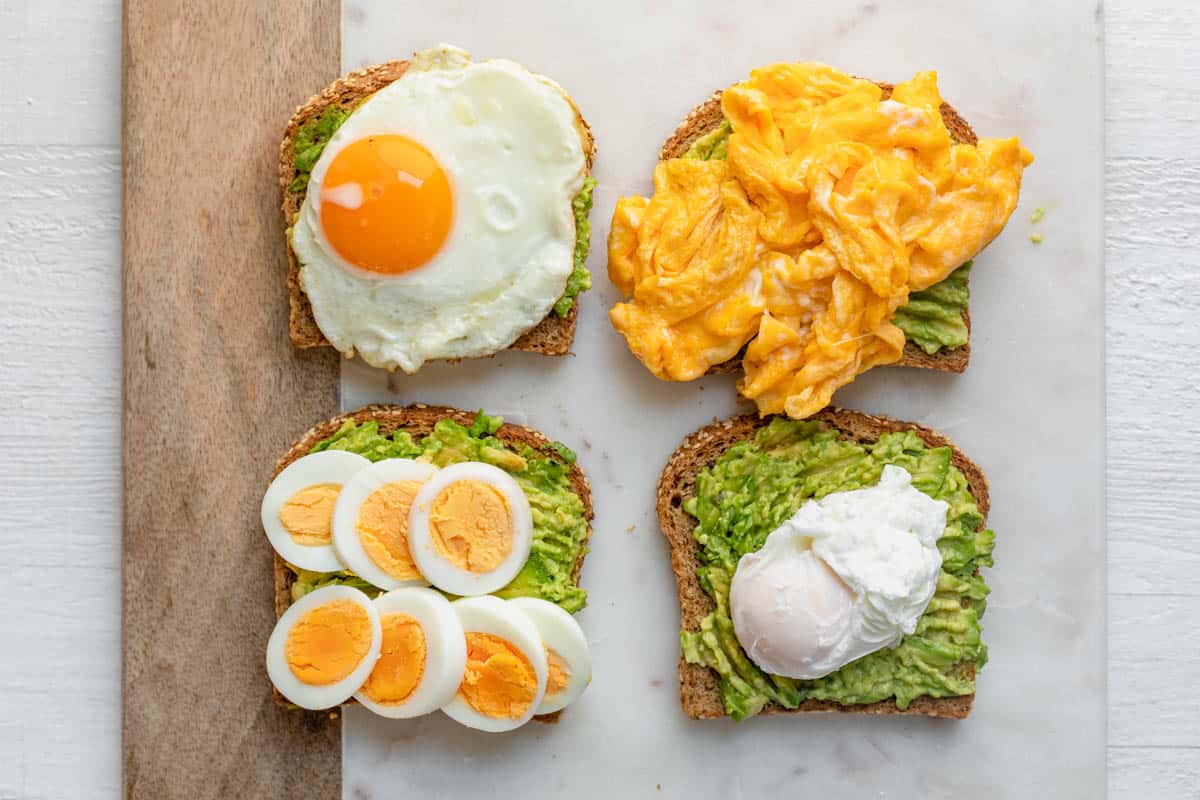 4 slices of toast each topped with different eggs