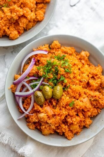 Mediterranean style bulgur pilaf in white bowls