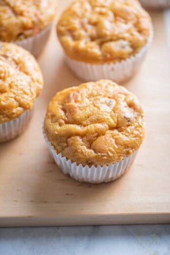 Carrot cake muffins on a wooden board