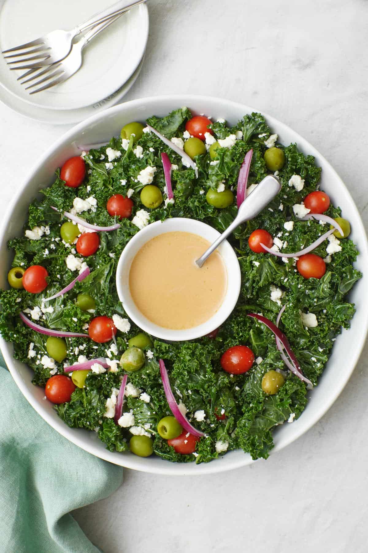 Christmas wreath salad on a marble background made with kale