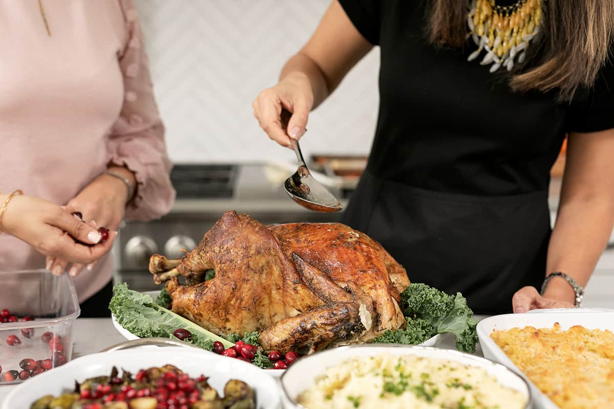 Transferring turkey drippings from pan to saucepan