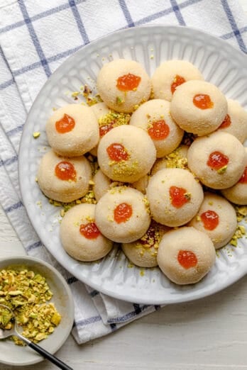 Large plate for ghraybeh shortbread cookies with pistachios on the side