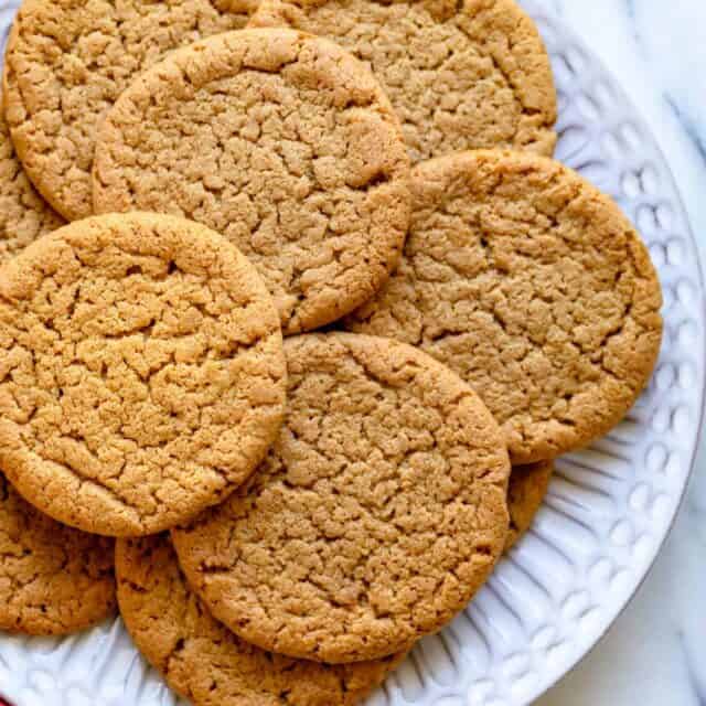 Plate of ginger snap cookies with red napkin on the side