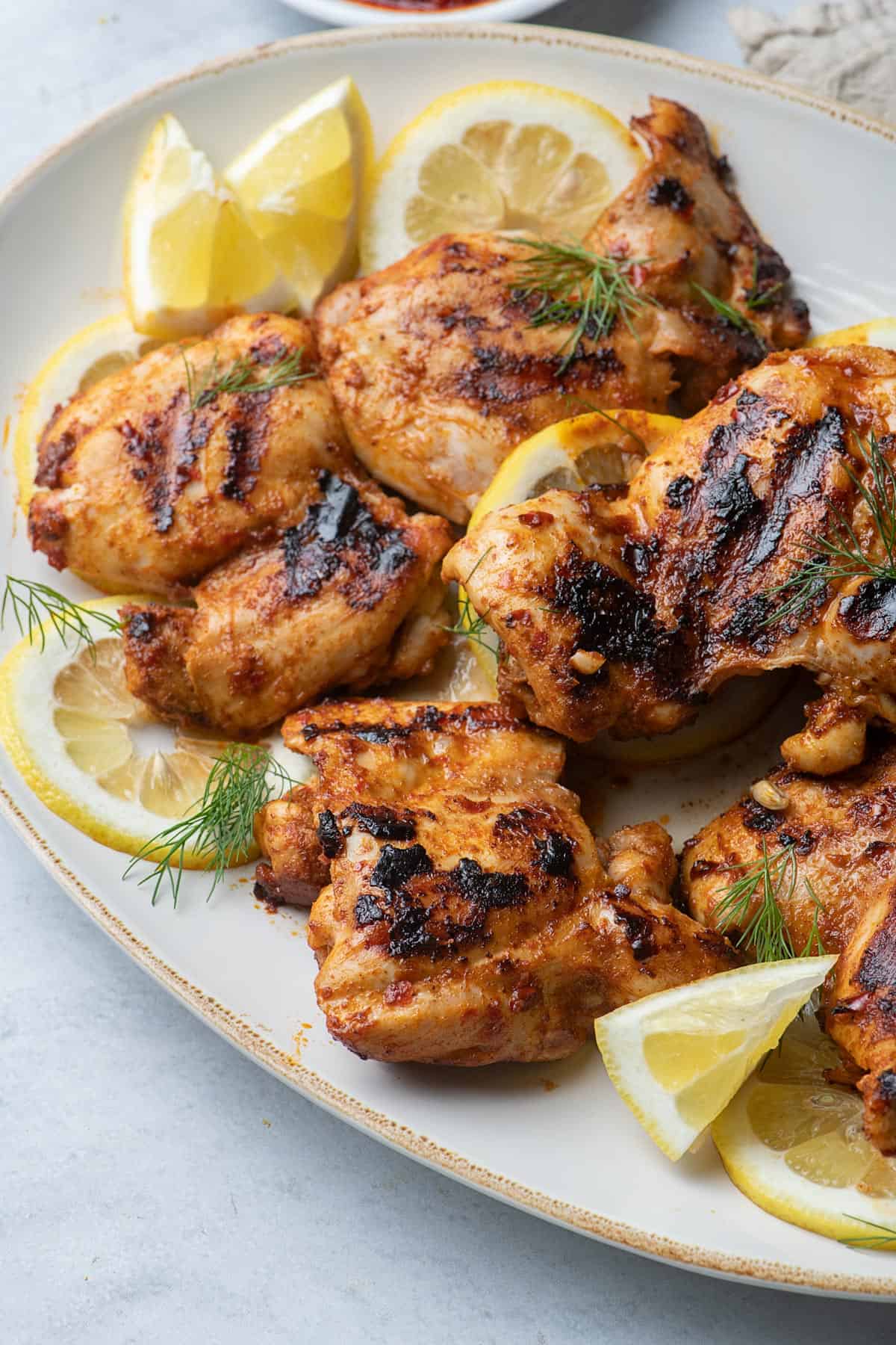 Close up shot of the grilled harissa chicken on a platter