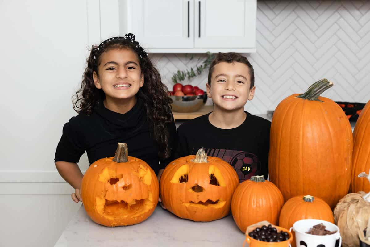 Carine and Adam after carving pumpkins at Halloween party