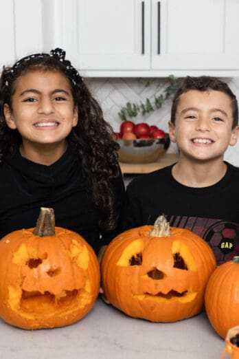 Carine and Adam after carving pumpkins at Halloween party