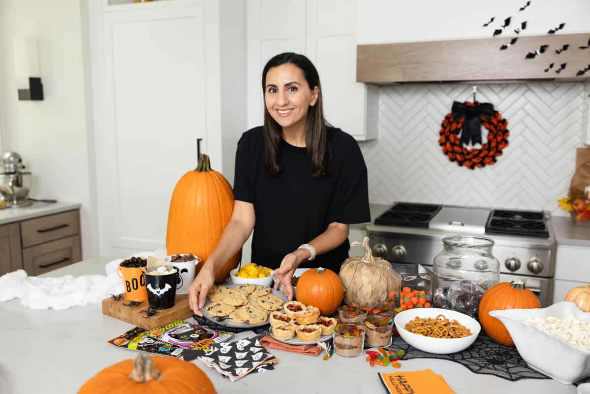 Yumna setting down cookies for Halloween party