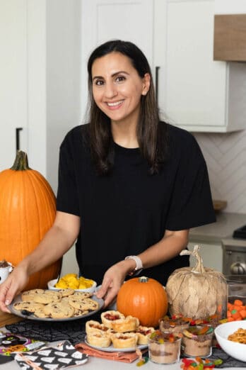 Yumna setting down cookies for Halloween party