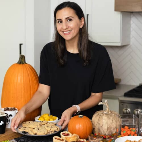 Yumna setting down cookies for Halloween party