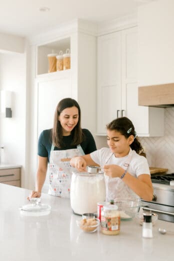 Yumna and kids in kitchen making cookies