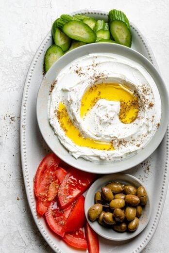 Labneh spread in a bowl with olive oil and zaatar