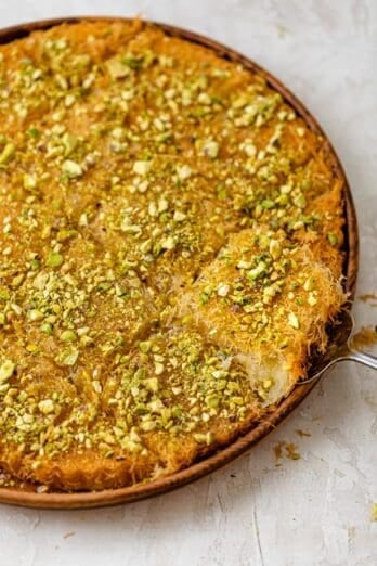 Lebanese kanafa cut into squares on a round dish