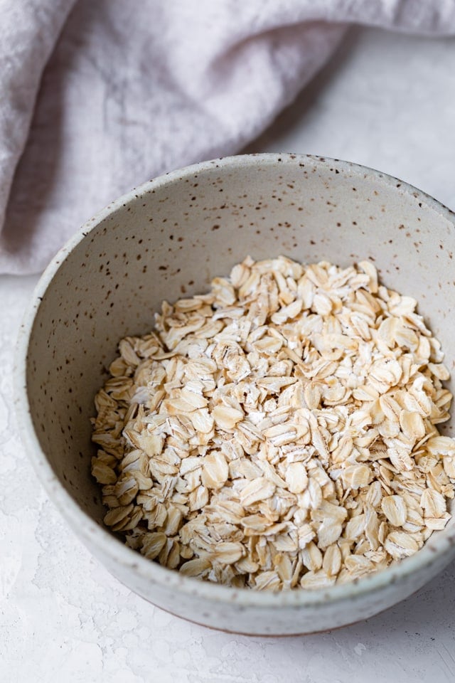 Old fashioned oats in a bowl used to make oatmeal