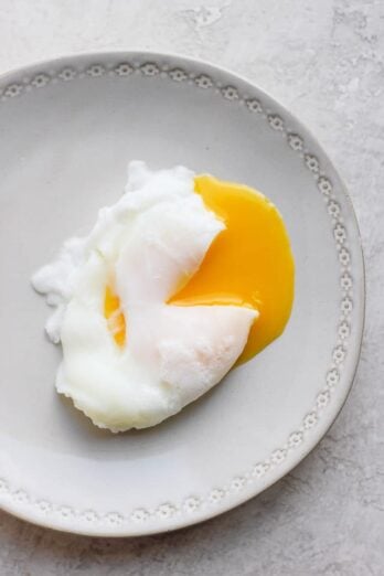 Poached egg on a gray plate