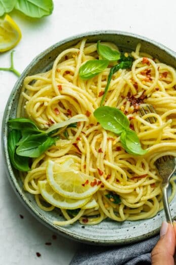 Close up shot of the hummus pasta with a fork twirling the pasta