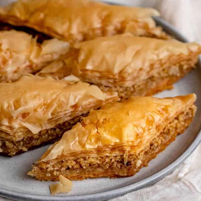 Side angle shot of sliced pieces of baklawa on a plate