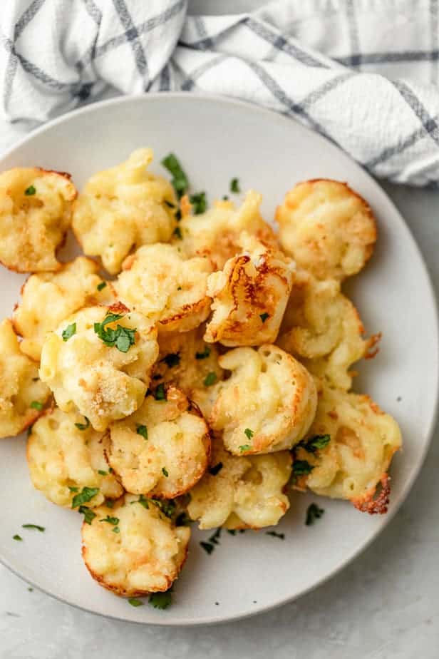 Mac and cheese bites on a plate after coming out of the oven