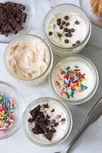 Top view of ice made in 4 mason jars with different toppings in each jar.