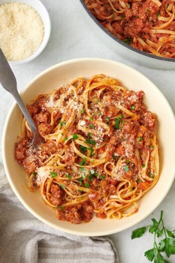 Close up shot of pasta bolognese on a white plate