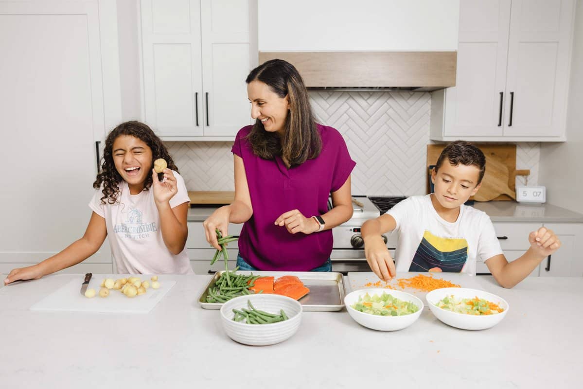 Yumna and kids in the kitchen preparing meal together