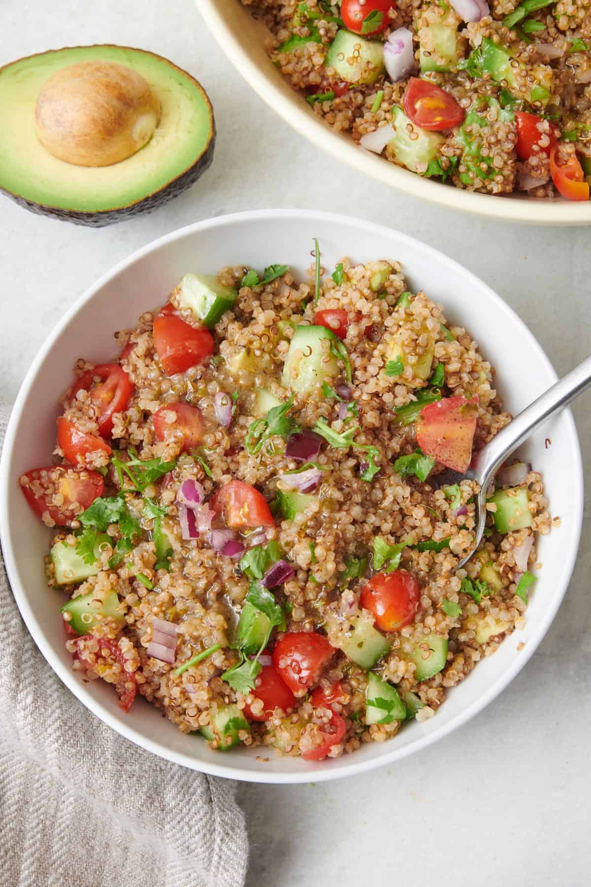 Toasted quinoa in a pan for making quinoa avocado salad