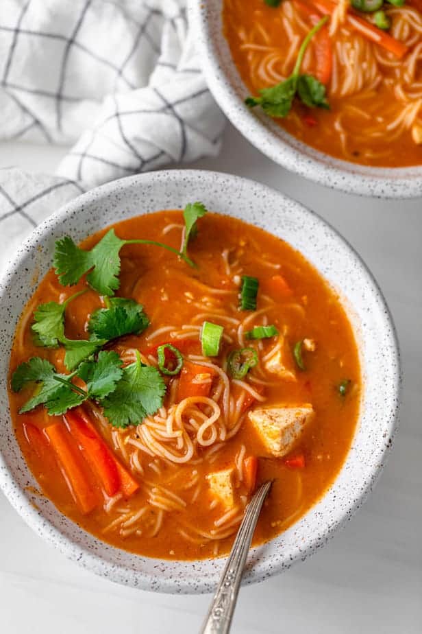 Red curry noodle soup bowl made with tofu