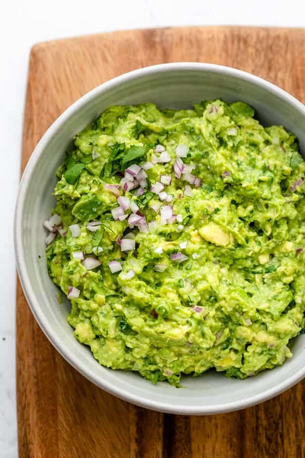 Simple guacamole recipe on a cutting board