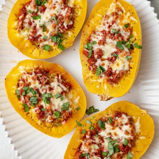 Collage of two images showing spaghetti squash halved before and after removing seeds