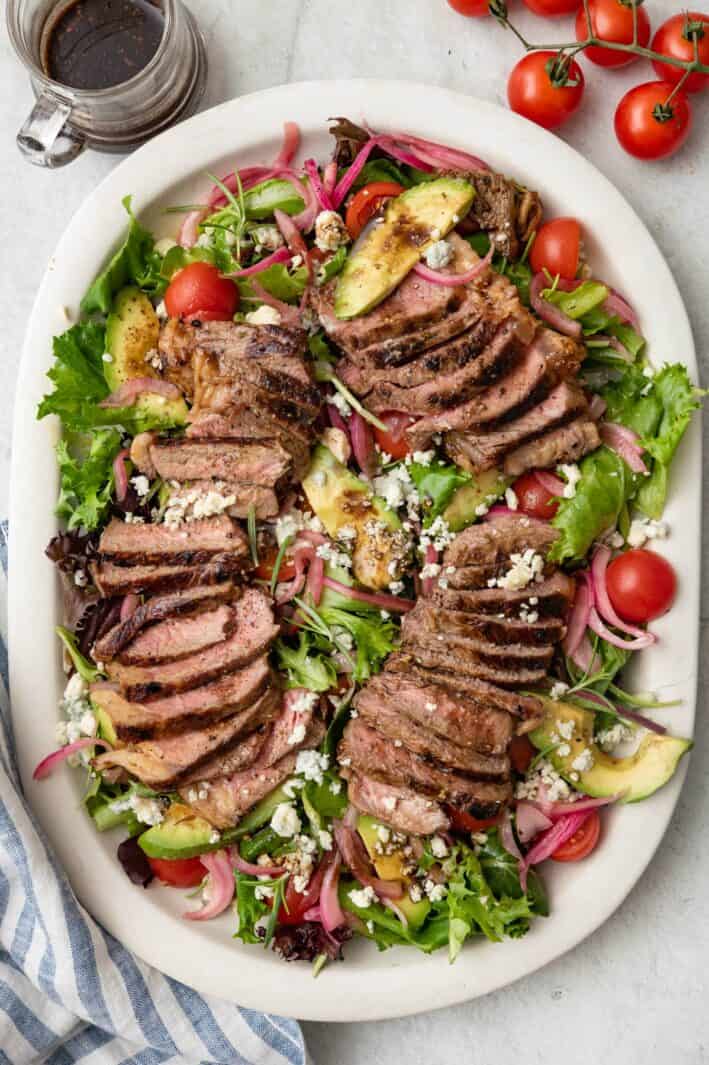 Steak salad on a large platter.