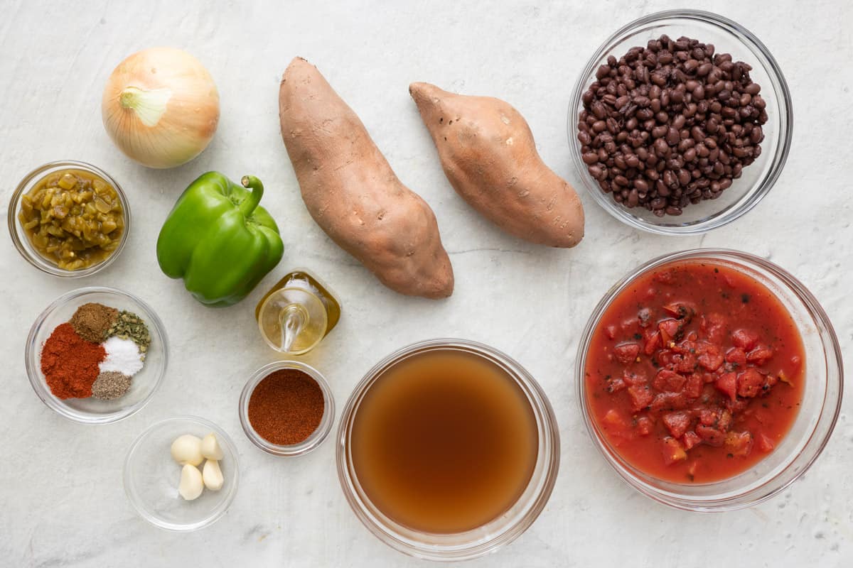 cubed sweet potatoes, onions and peppers in a pot