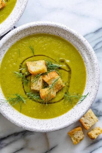 Large bowl of vegan broccoli soup with croutons on top