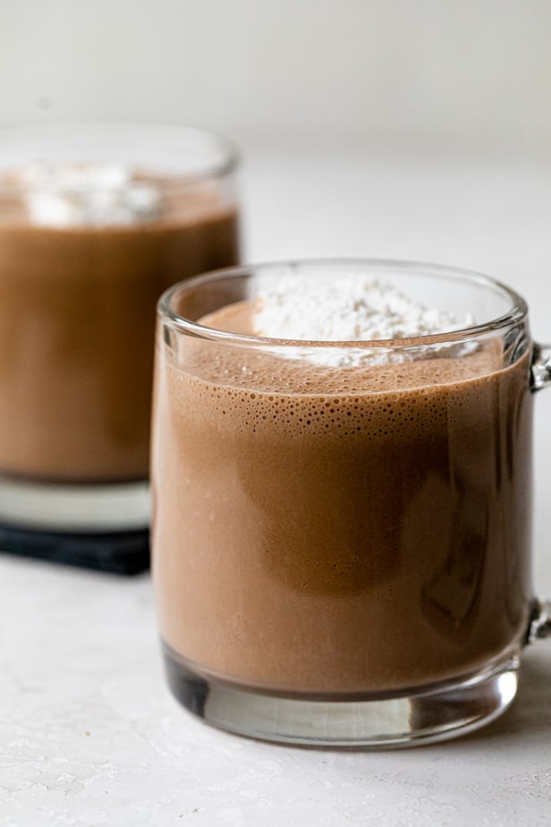 Two mugs full of the plant-based homemade hot chocolate