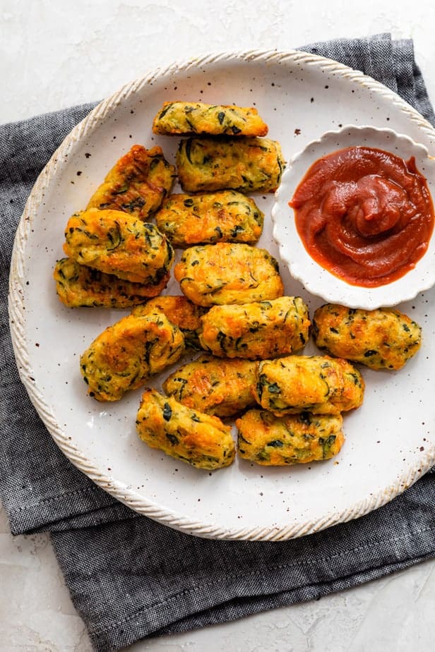 Plate of zucchini tots served with ketchup